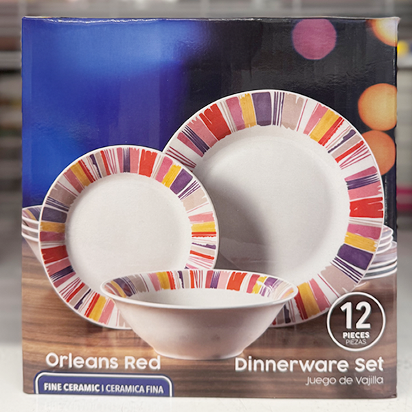 Packaging for a 12‑piece “Orleans Red” dinnerware set, showing plates and a bowl with multicolored brushstroke borders against a blue background.